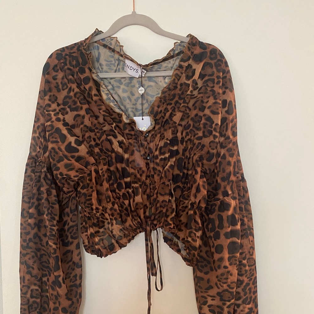 Sandy’s Revolve Cheetah top